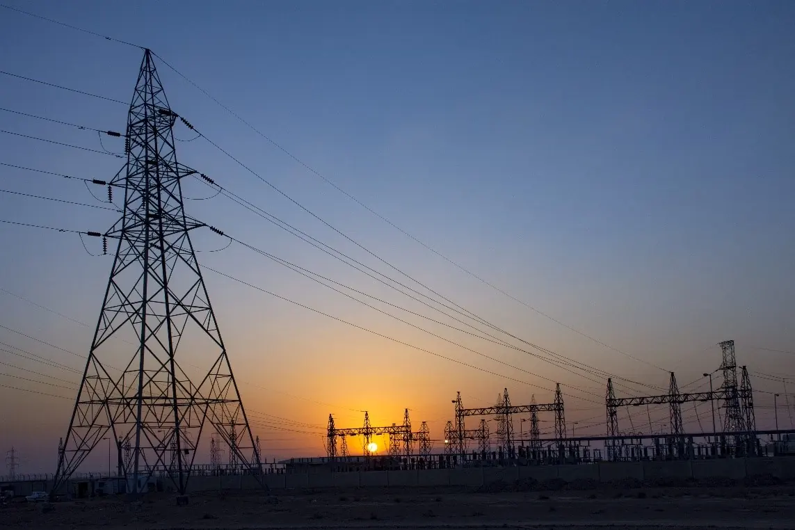 Substation and transmission line at sunset